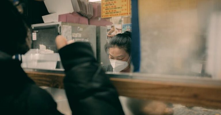 Customer Perception - A woman wearing a face mask in a restaurant